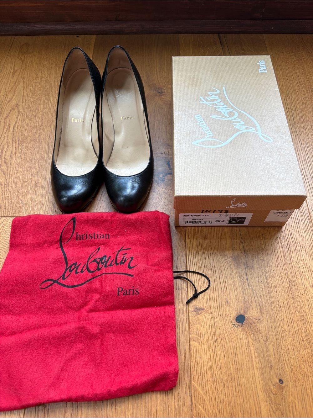 Christian Louboutin Simple Black Leather Round-Toe Pumps